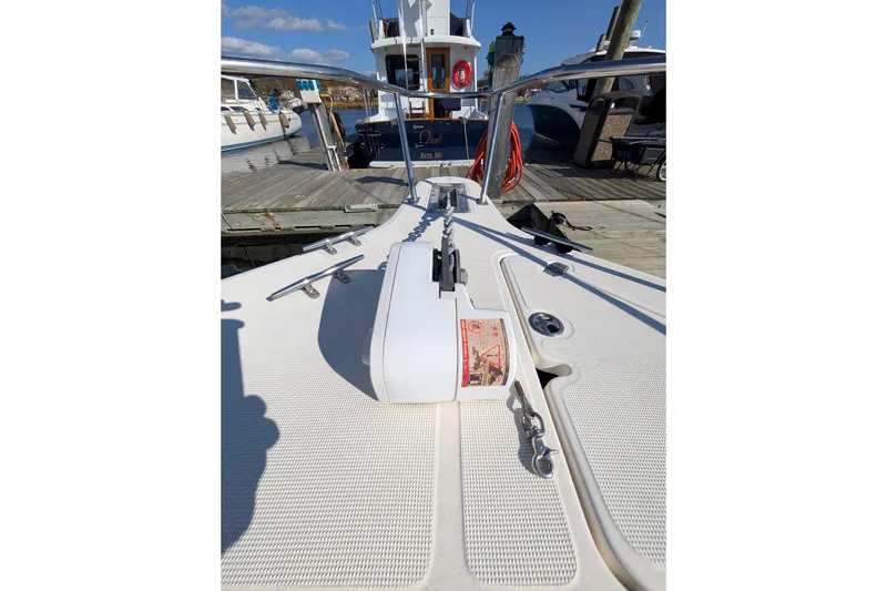 Slide: The Image of 2004 Pursuit 2870 Center Console boat docked at marina, sunny day. - 2