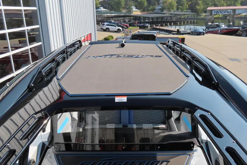 Slide: The Image of 2024 Sunsation 32CCX boat, top view, docked near a marina. - 14