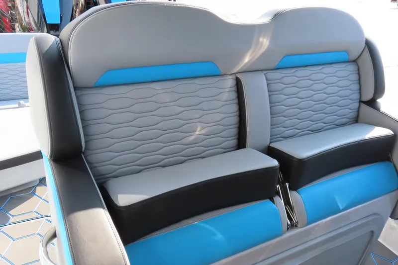 Slide: The Image of 2024 Sunsation 32CCX boat interior seating with blue and gray upholstery. - 15