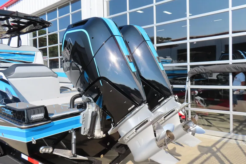 Slide: The Image of 2024 Sunsation 32CCX boat with dual outboard engines, showcased outdoors. - 20