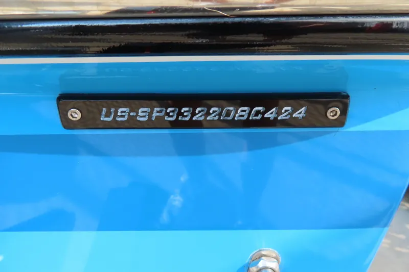 Slide: The Image of 2024 Sunsation 32CCX boat hull identification number on blue surface. - 22