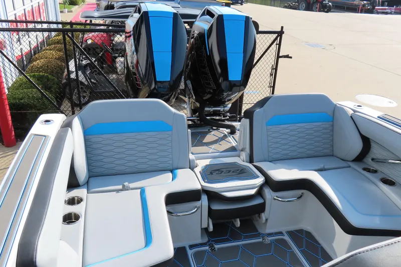 Slide: The Image of 2024 Sunsation 32CCX boat interior with stylish seating and dual outboard motors. - 5