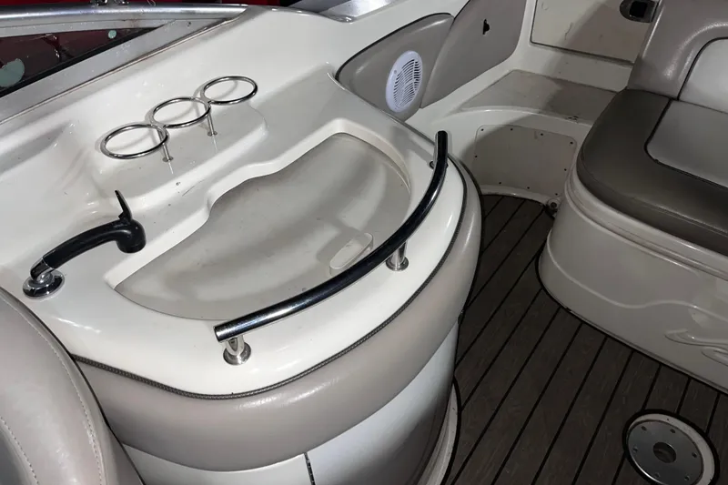 Slide: The Image of Interior of 2002 Sea Ray 270 Sundeck boat with cup holders and seating area. - 6