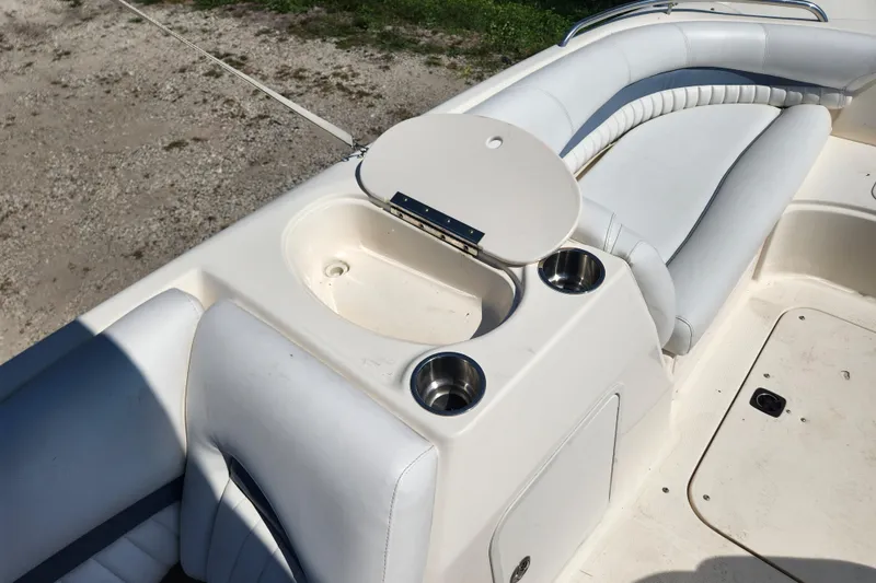 Slide: The Image of 2007 Hurricane FunDeck GS 194 O/B boat interior with white cushioned seating. - 12