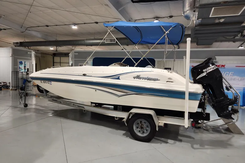 Slide: The Image of 2007 Hurricane FunDeck GS 194 OB with Suzuki outboard motor in showroom. - 18