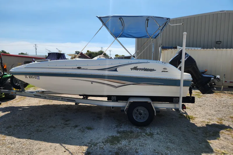 Slide: The Image of 2007 Hurricane FunDeck GS 194 OB boat on trailer in indoor showroom. - 3