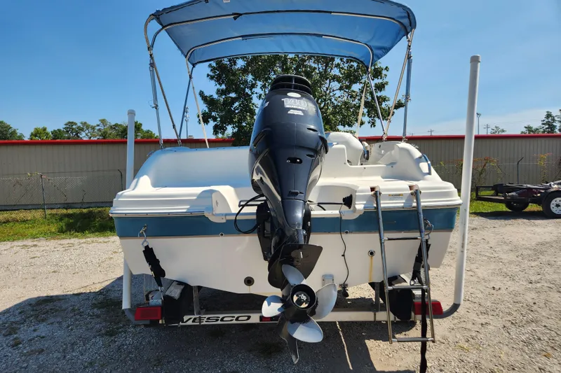 Slide: The Image of 2007 Hurricane FunDeck GS 194 O/B boat with canopy, parked outdoors. - 5