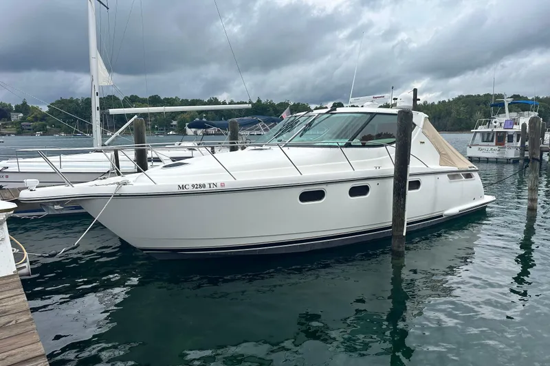 The Image of 2007 Tiara Yachts 3900 Sovran docked in a marina under cloudy skies. - 0