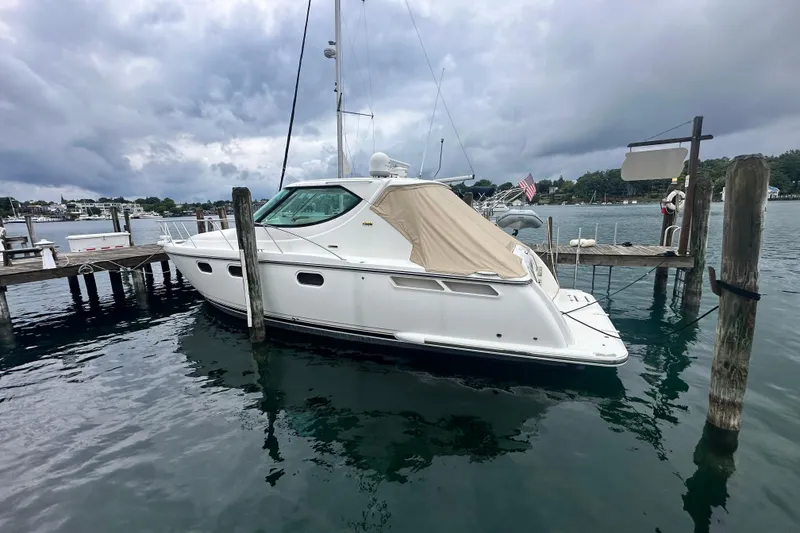 Slide: The Image of 2007 Tiara Yachts 3900 Sovran docked at a marina under cloudy skies. - 1