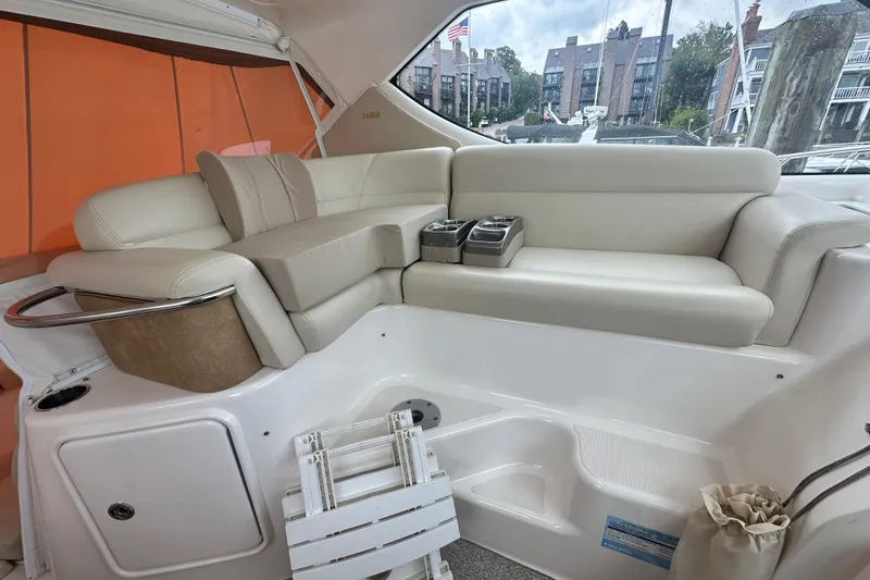 Slide: The Image of 2007 Tiara Yachts 3900 Sovran interior with beige seating and cup holders. - 11