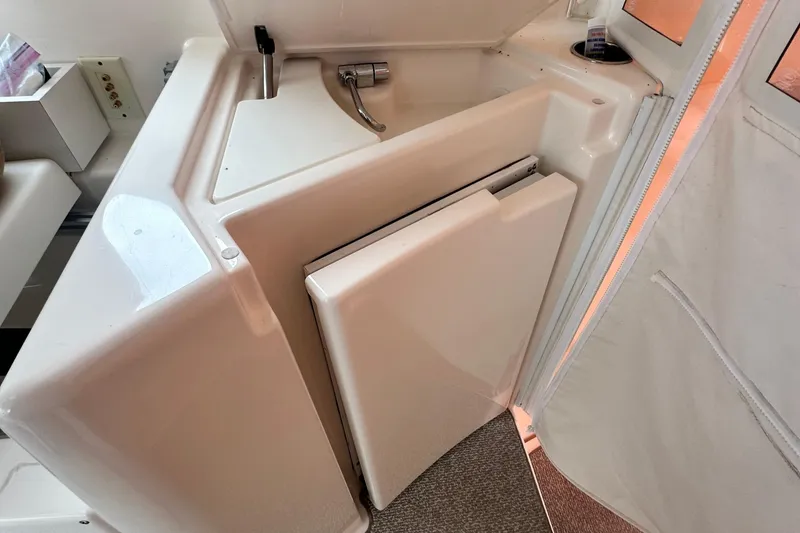 Slide: The Image of 2007 Tiara Yachts 3900 Sovran interior sink and storage area. - 12