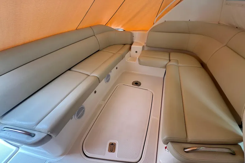 Slide: The Image of 2007 Tiara Yachts 3900 Sovran interior with beige leather seating and storage compartment. - 14