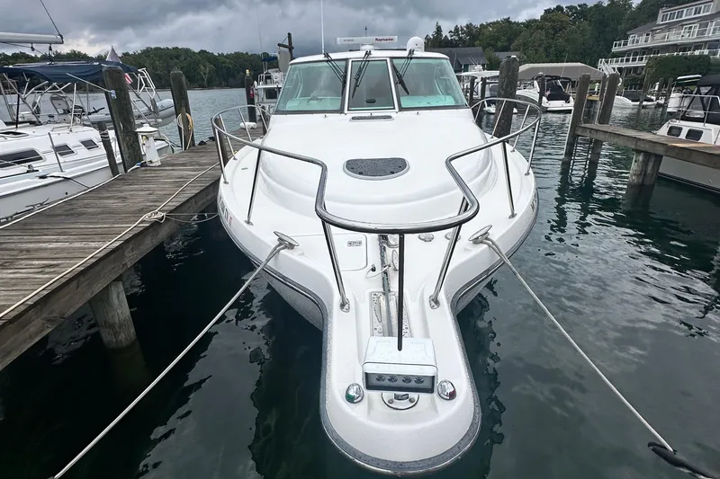 Slide: The Image of 2007 Tiara Yachts 3900 Sovran docked at a marina, front view. - 2