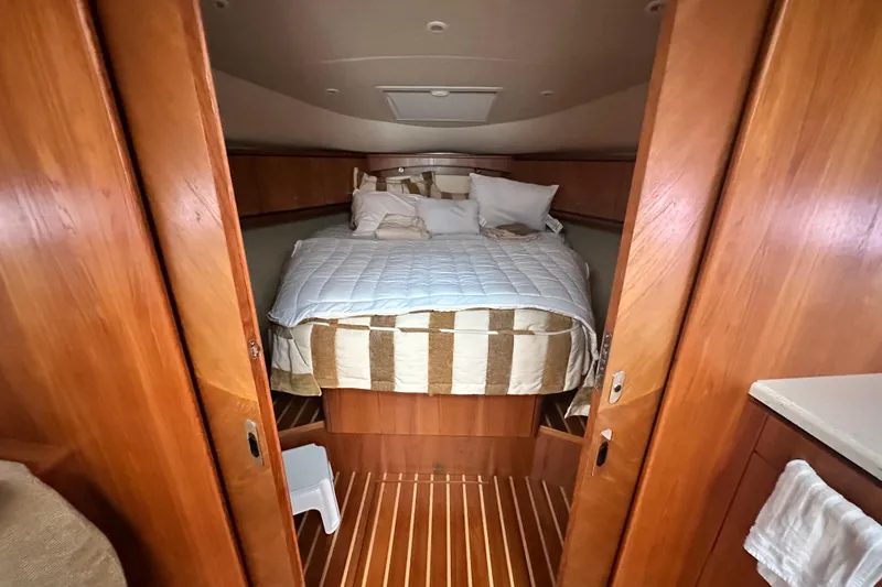 Slide: The Image of Luxurious cabin interior of 2007 Tiara Yachts 3900 Sovran with cozy bed and wooden finish. - 21