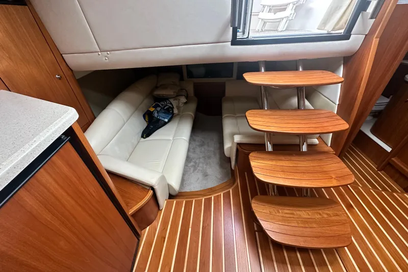 Slide: The Image of 2007 Tiara Yachts 3900 Sovran interior with wooden steps and cream leather seating. - 23