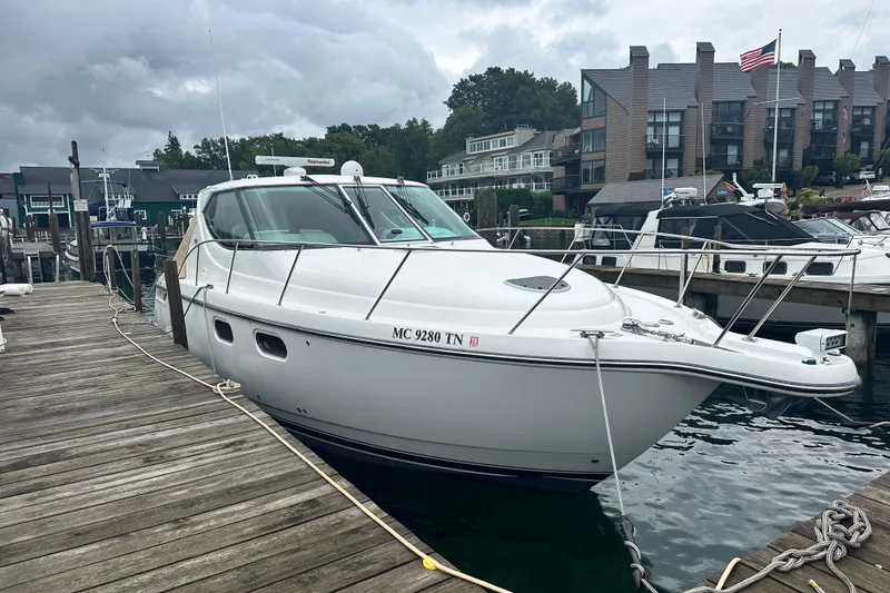 Slide: The Image of 2007 Tiara Yachts 3900 Sovran docked at a marina with overcast skies. - 4
