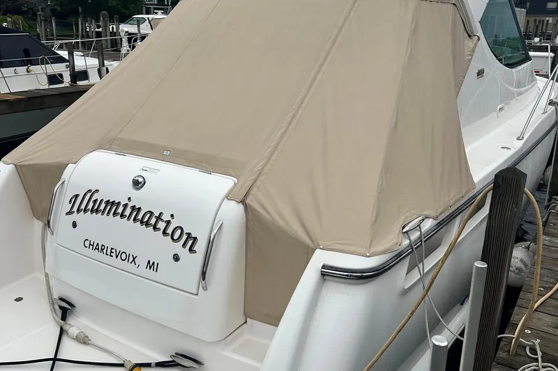 Slide: The Image of 2007 Tiara Yachts 3900 Sovran docked, covered, with "Illumination" name, Charlevoix, MI. - 5