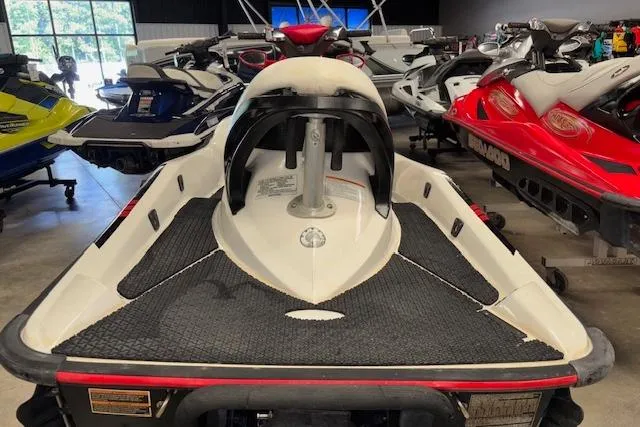 Slide: The Image of 2006 Sea-Doo Wake jet ski in showroom, surrounded by other personal watercraft. - 6