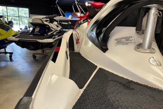 Slide: The Image of 2006 Sea-Doo Wake jet ski in showroom, close-up view of side and deck. - 7