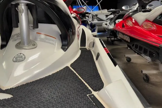 Slide: The Image of 2006 Sea-Doo Wake jet ski in showroom, showcasing sleek design and vibrant colors. - 8