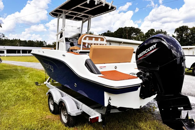 Slide: The Image of 2023 Bayliner Trophy T20CC boat with Mercury engine on trailer, outdoors. - 5