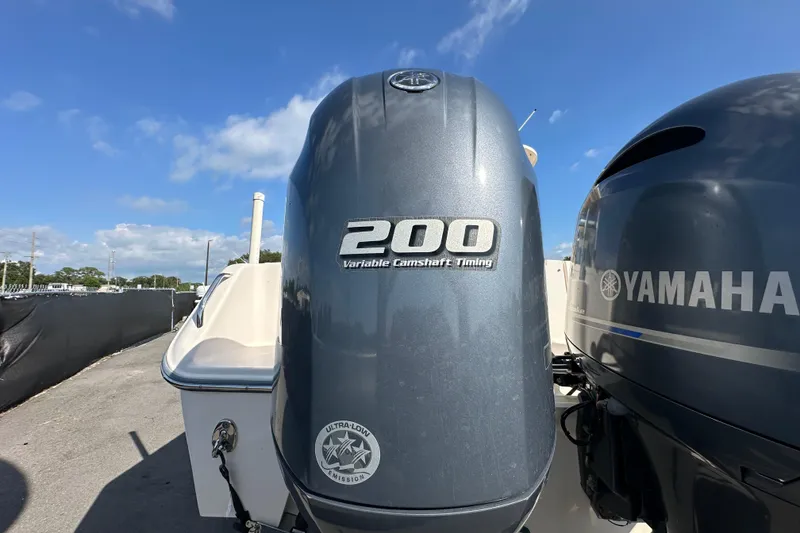 Slide: The Image of 2016 Grady-White Freedom 275 boat on trailer under clear blue sky. - 10