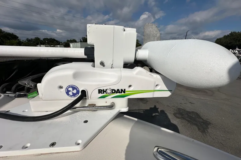 Slide: The Image of 2016 Grady-White Freedom 275 boat interior with white seating and storage compartment. - 102