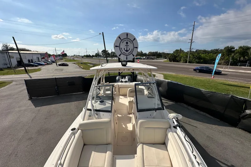 Slide: The Image of Open hatch on 2016 Grady-White Freedom 275 boat, revealing storage compartment. - 106