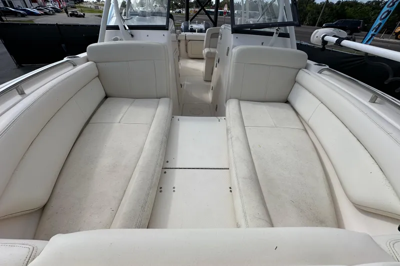 Slide: The Image of Trailer wheels of a 2016 Grady-White Freedom 275 boat on pavement. - 110