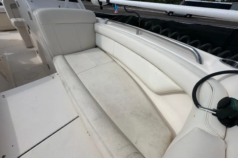 Slide: The Image of Trailer wheels of a 2016 Grady-White Freedom 275 boat, secured with chocks. - 111