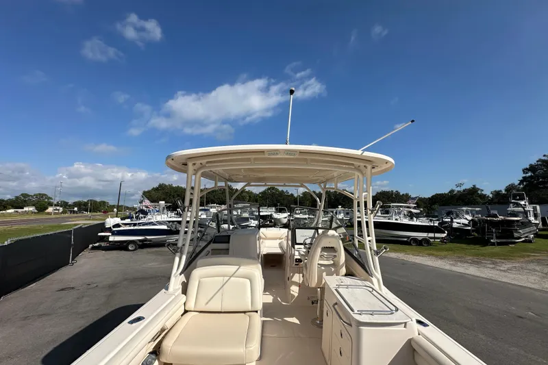 Slide: The Image of 2016 Grady-White Freedom 275 boat interior with seating and storage compartments. - 15