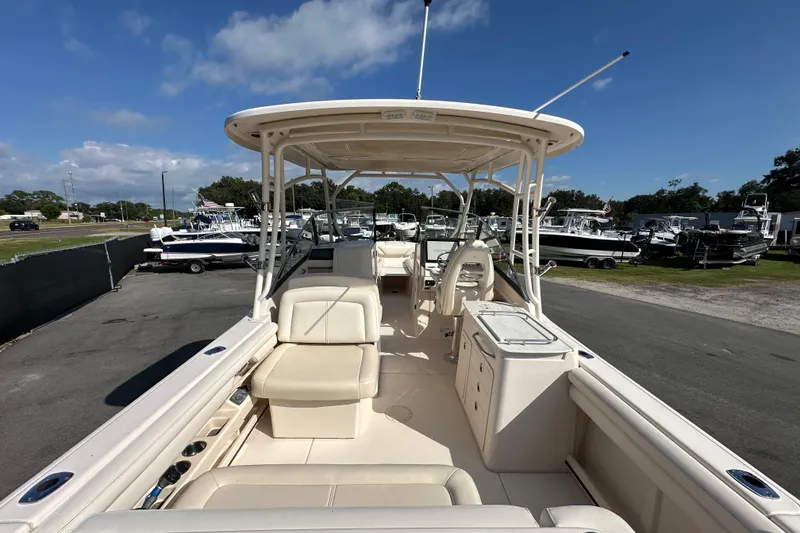 Slide: The Image of 2016 Grady-White Freedom 275 boat interior with seating and storage compartments. - 16