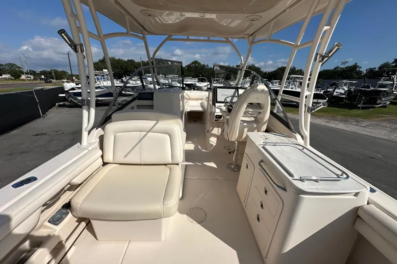 Slide: The Image of 2016 Grady-White Freedom 275 boat interior with sink and storage compartments. - 20