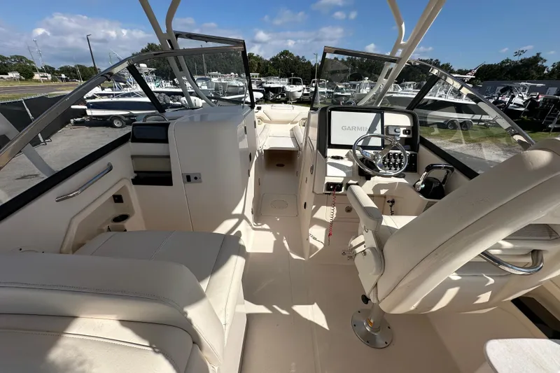 Slide: The Image of Control panel and cup holder on 2016 Grady-White Freedom 275 boat. - 24