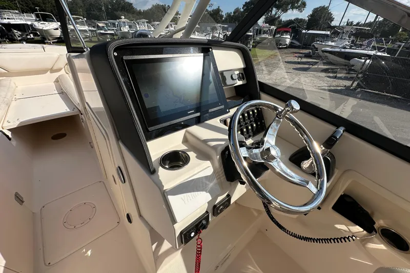 Slide: The Image of Control panel of a 2016 Grady-White Freedom 275 boat with Yamaha ignition system. - 28