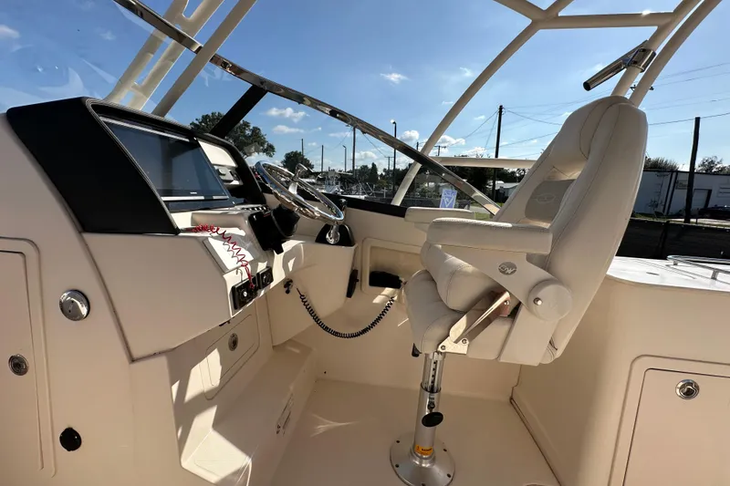Slide: The Image of Interior detail of 2016 Grady-White Freedom 275 boat with storage net and cup holder. - 36