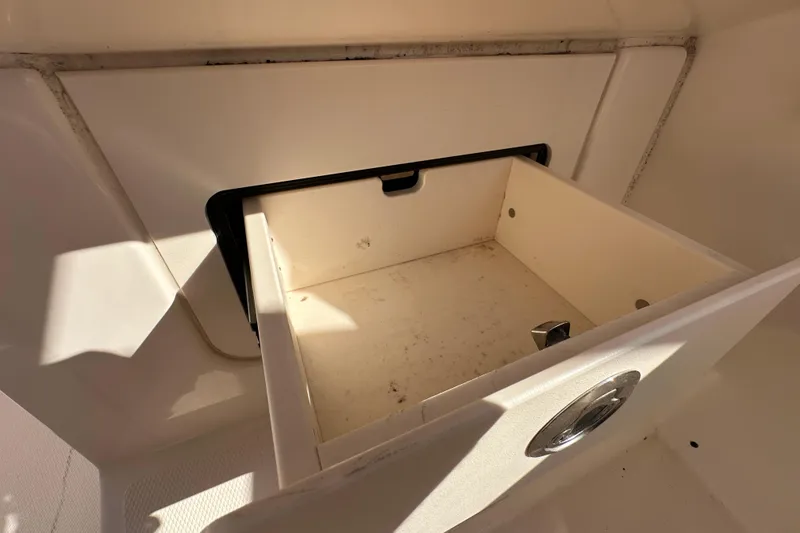 Slide: The Image of Interior of 2016 Grady-White Freedom 275 boat, featuring a mirror and storage area. - 39