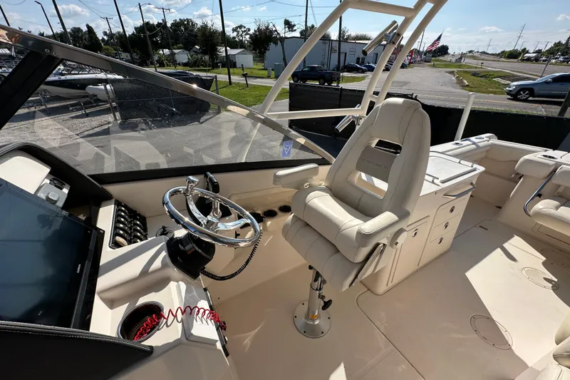 Slide: The Image of 2016 Grady-White Freedom 275 boat interior with open storage compartment. - 42
