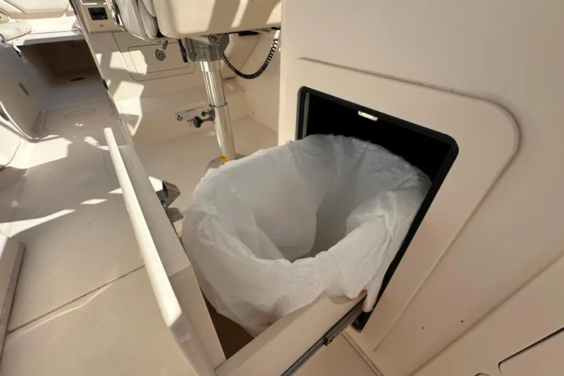 Slide: The Image of 2016 Grady-White Freedom 275 boat interior with mounted trolling motor. - 51