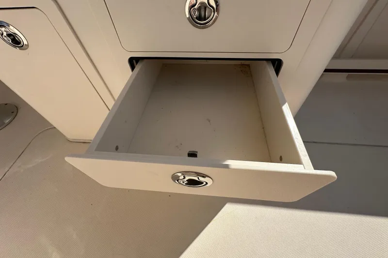 Slide: The Image of Anchor system on 2016 Grady-White Freedom 275 boat with warning tag visible. - 53