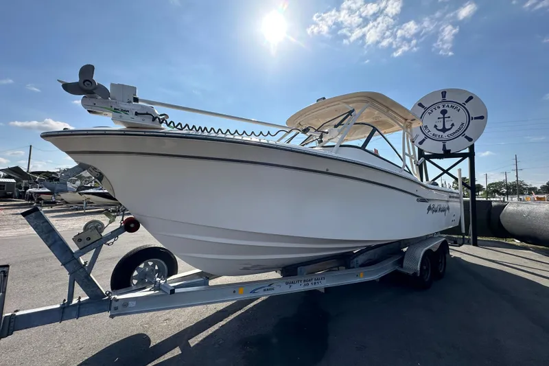 Slide: The Image of 2016 Grady-White Freedom 275 boat with dual outboard motors and propellers. - 6