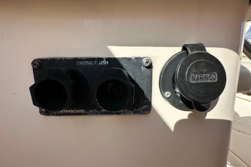 Slide: The Image of 2016 Grady-White Freedom 275 boat interior with seating and steering wheel. - 60