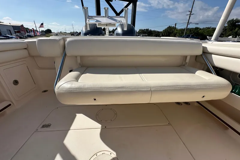 Slide: The Image of 2016 Grady-White Freedom 275 boat interior with seating and dual engines. - 62