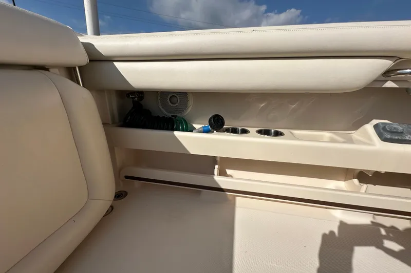 Slide: The Image of 2016 Grady-White Freedom 275 boat with dual 200 horsepower engines, open storage compartments. - 66