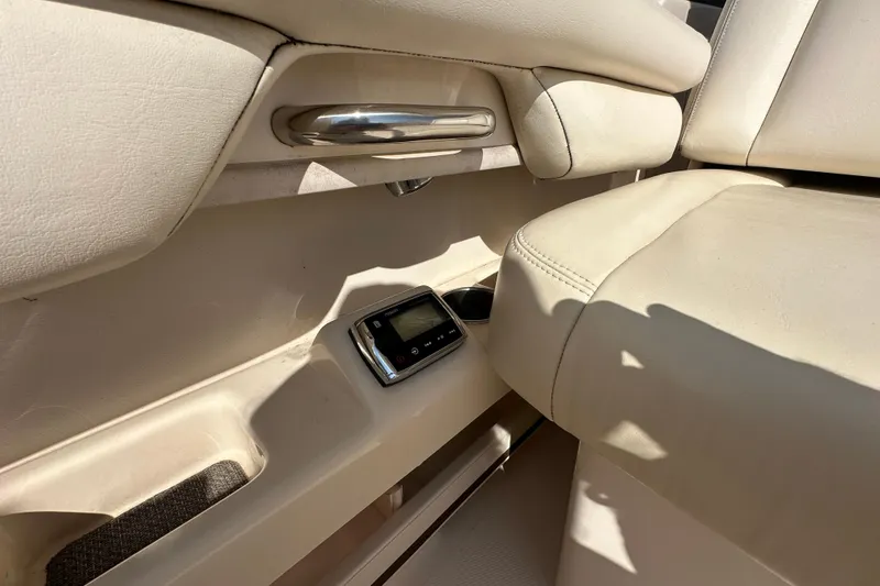 Slide: The Image of 2016 Grady-White Freedom 275 boat with open storage compartments and Yamaha 200 engines. - 68