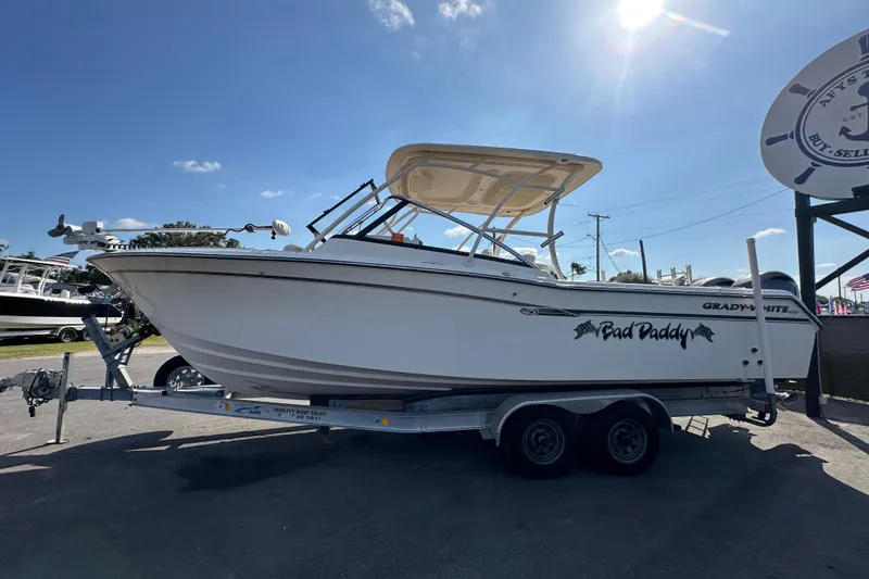 Slide: The Image of 2016 Grady-White Freedom 275 boat with Yamaha outboard motor on trailer. - 7
