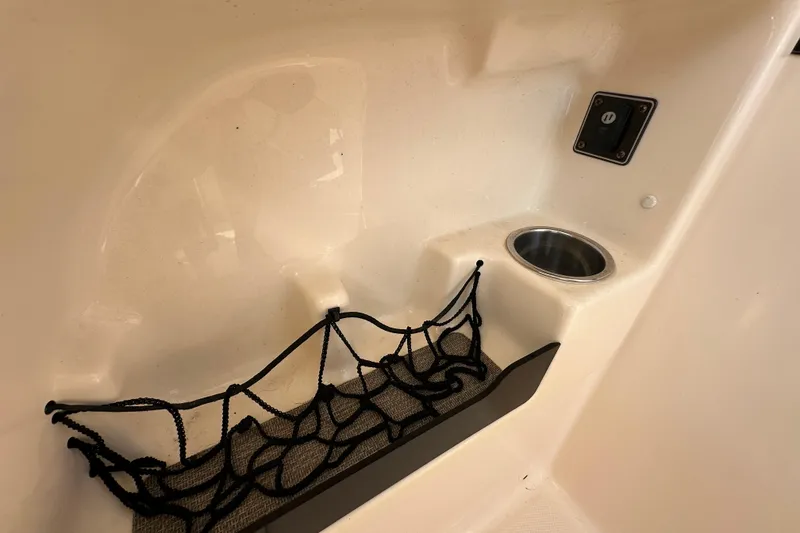 Slide: The Image of 2016 Grady-White Freedom 275 with twin Yamaha 200 engines, parked outdoors. - 73