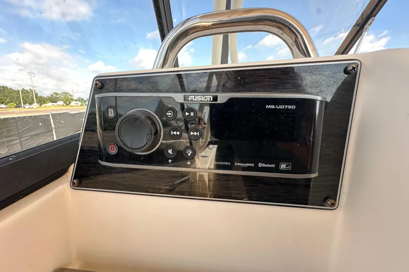 Slide: The Image of Trailer wheels for 2016 Grady-White Freedom 275 boat on pavement. - 76