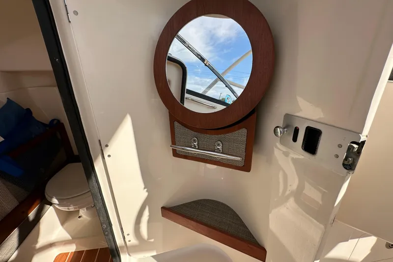 Slide: The Image of Close-up of Yamaha F200XCA engine part on 2016 Grady-White Freedom 275 boat. - 79