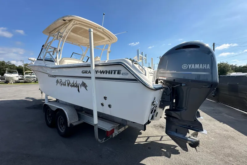Slide: The Image of 2016 Grady-White Freedom 275 boat with Yamaha engine and American flag. - 8